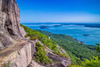 A narrow ledge on the Precipice Trail in Acadia National Park overlooks the Atlantic Ocean and surrounding islands on a clear day.